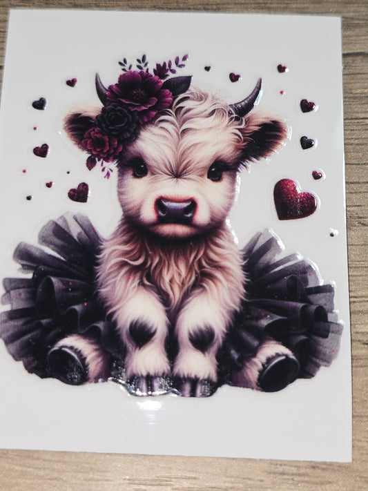 Snowy black & maroon tu-tu cow medium clear UV DTF decal