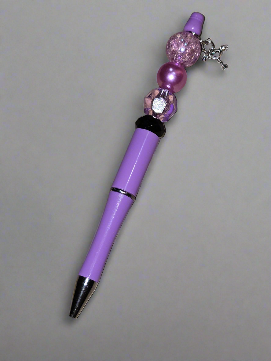 Purple focal bead with heart & key charm pen